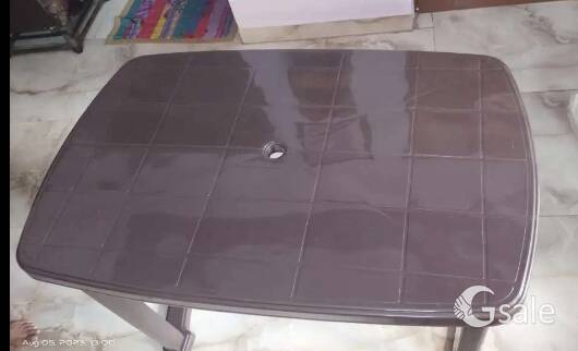 Foldable brown dining table
