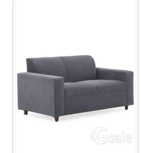 grey soft cushioned sofa