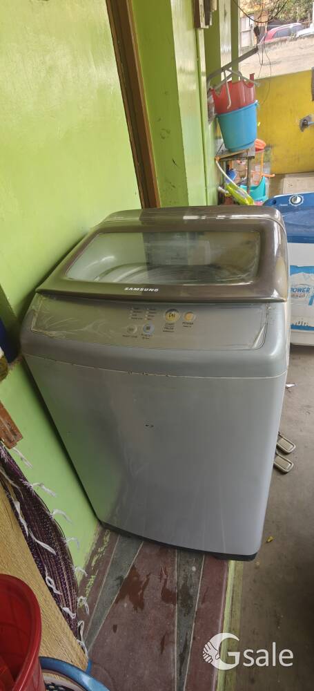 The Samsung WA62H4100HD is a 6.2 kg fully automatic top-loading washing machine in silver